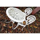 A WHITE PAINTED ALUMINIUM GARDEN TABLE 69cm in diameter and two similar chairs (3)