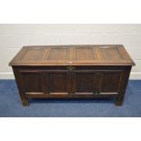 A GEORGIAN OAK FOUR PANELLED COFFER, with brass escutcheon supported on block feet, width 147cm x