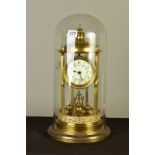 AN EARLY 20TH CENTURY GERMAN BRASS ANNIVERSARY CLOCK, the domed canopy on six columns, the enamel