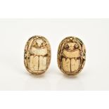 A PAIR OF YELLOW METAL EARRINGS, each earring of oval design in the forms of carved wooden scarab
