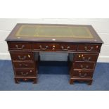 A MAHOGANY PEDESTAL DESK, with a green tooled leather inlay top, and nine various drawers, width