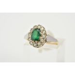 A 9CT GOLD CLUSTER RING, designed as a raised cluster set with a central oval cut green stone,