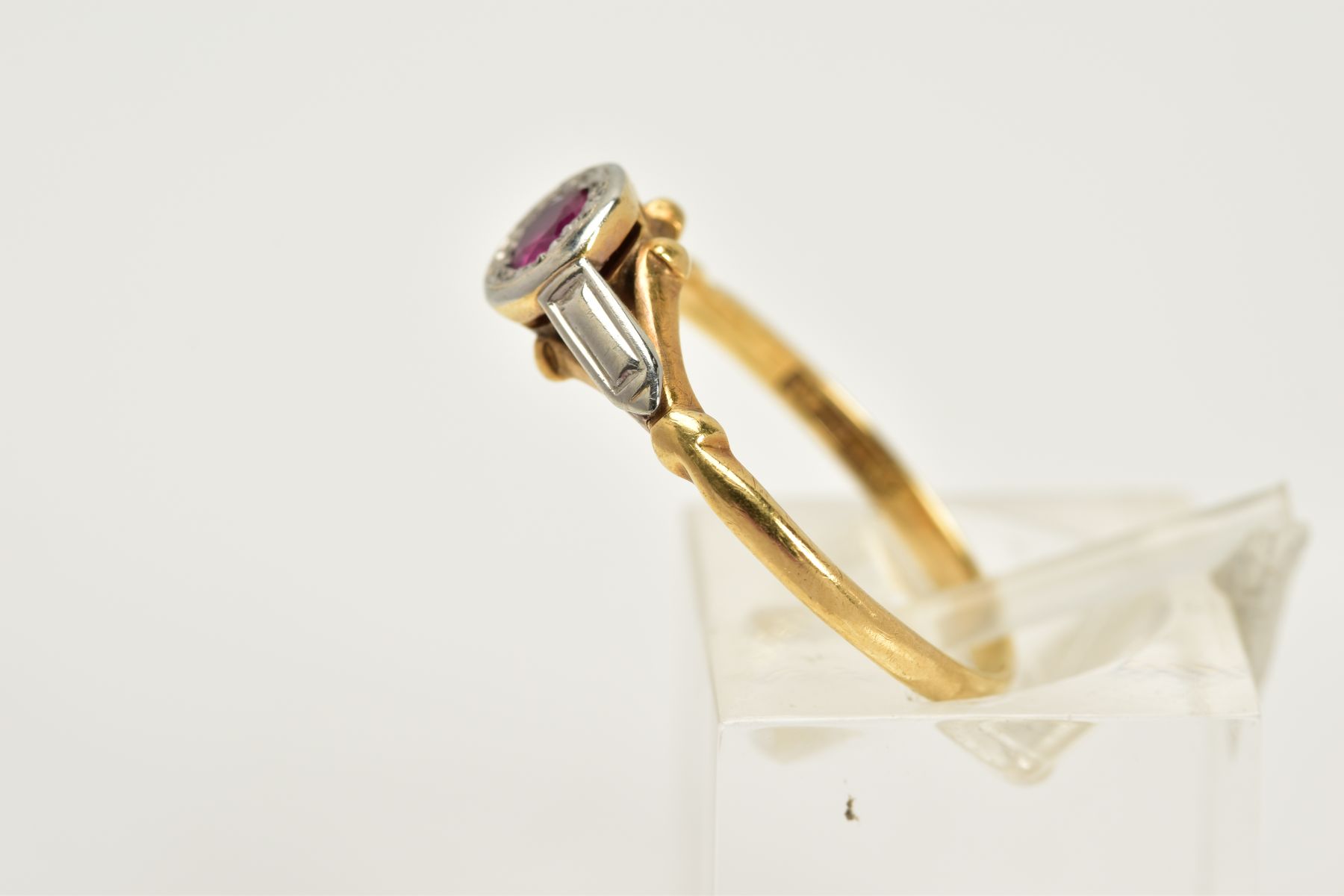 A YELLOW METAL RUBY RING, designed with a single circular cut ruby within a collet mount, textured - Image 2 of 4