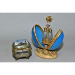 A LATE 19TH CENTURY BLUE OPAQUE GLASS AND GILT METAL EGG SHAPED SCENT BOTTLE HOLDER, the floral
