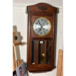 A 1920'S OAK DROP CASE WALL CLOCK, silvered dial with Arabic numerals, eight day movement, the