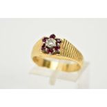 AN 18CT GOLD RUBY AND DIAMOND CLUSTER RING, the tiered cluster set with a central round brilliant