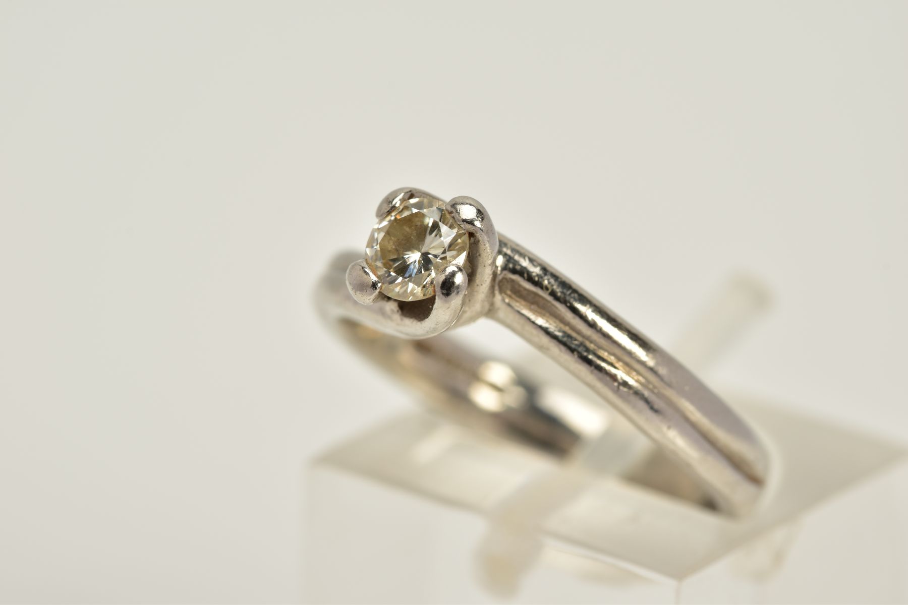 A PLATINUM SINGLE STONE DIAMOND RING, of crossover design, with a claw set round brilliant cut - Image 2 of 5