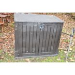 A PLASTIC GARDEN TOOL CUPBOARD with lift up lid and two doors to front, width 127cm x depth 72cm x