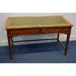 AN EDWARDIAN MAHOGANY DESK, with a green leather top, and two frieze drawers, on square tapering