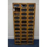 AN EARLY TO MID 20TH CENTURY BEECH HABERDASHERY CABINET, made up of thirty three drawers, width 84cm