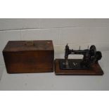 A VINTAGE SCHULT SEWING MACHINE (key)