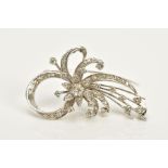 A WHITE METAL FLORAL DIAMOND BROOCH, of openwork floral and foliate design, set with round brilliant