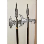 TWO 20TH CENTURY REPLICA HALBARDS, engraved blades, wooden shafts, heights 179cm and 177cm (2)