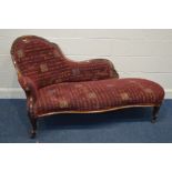 A VICTORIAN WALNUT CHAISE LONGUE, with a serpentine front, on cabriole and scroll legs, length
