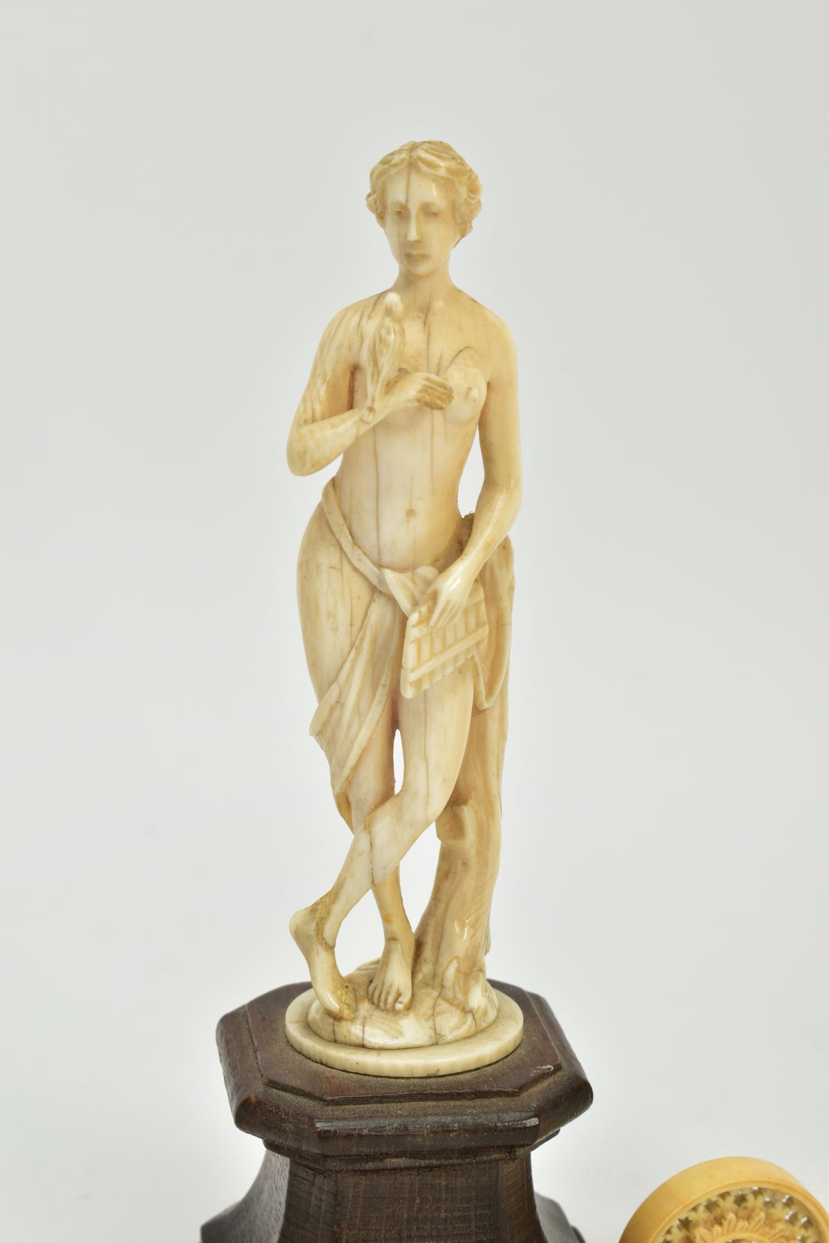 A 19TH CENTURY CARVED IVORY FIGURE OF A SCANTILY CLAD FEMALE WITH A BIRD AND PIPES, mounted on a - Image 2 of 9