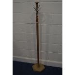 AN OAK HAT/COAT STAND, with six hooks on an hexagonal upright, height 153cm