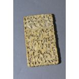 A 19TH CENTURY CHINESE CANTON CARVED IVORY CARD CASE, of rectangular form, pull off cover, carved