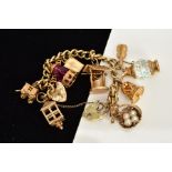 A 9CT GOLD CHARM BRACELET, the curb link bracelet suspending eleven charms, such as stanhope