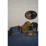 AN EDWARDIAN MAHOGANY OVAL BEVELLED EDGE WALL MIRROR, together with an oak wall mirror with canted