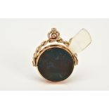 A 9CT GOLD SWIVEL FOB, of circular design, swivels to reveal bloodstone and carnelian panels, within