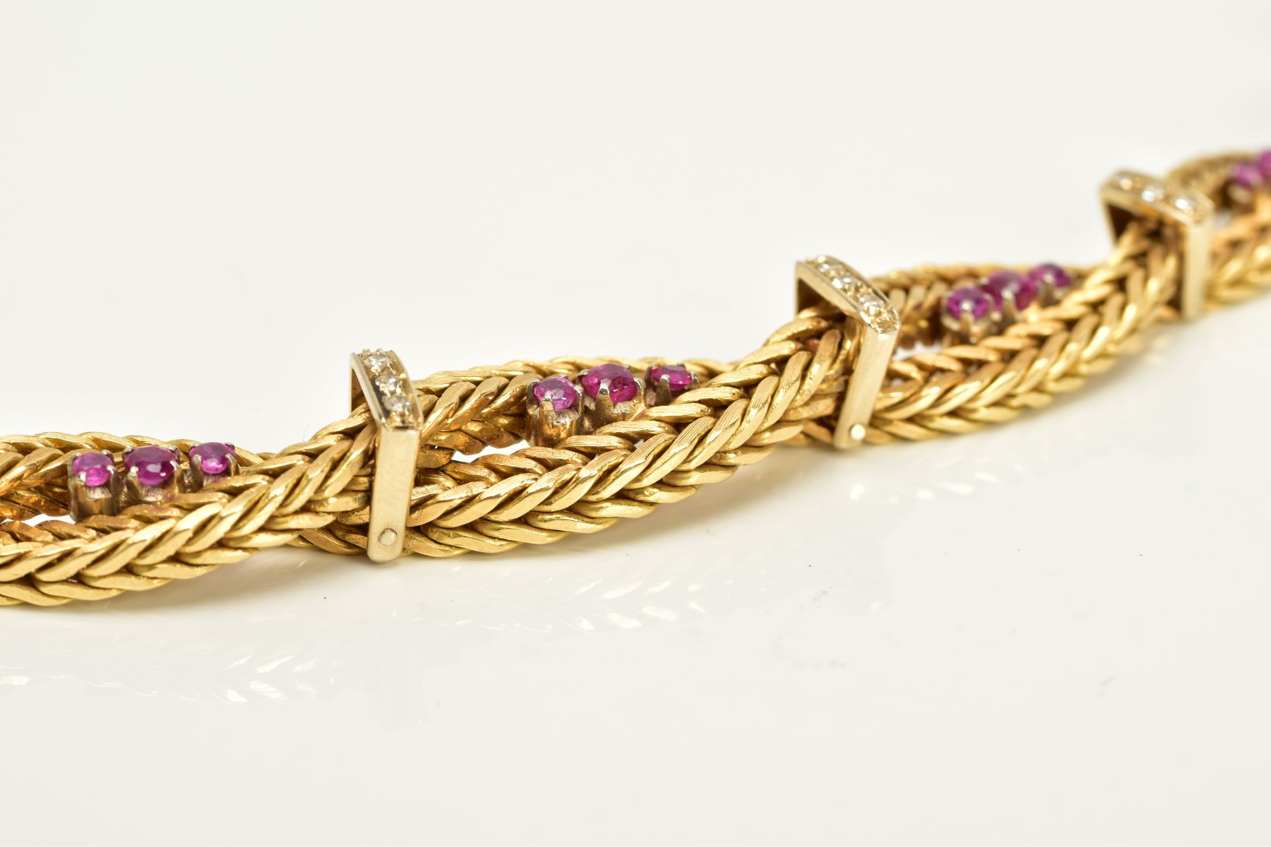 A MODERN YELLOW METAL DIAMOND AND RUBY BRACELET, designed as a twisted box chain bracelet, seven - Image 6 of 6