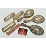 A SELECTION OF VANITY ITEMS, to include two silver hand held, floral and foliate embossed mirrors,