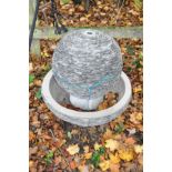 A WOODLODGE LAGOON WATER FEATURE constructed from slate shards around a composite structure with