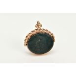 A 9CT GOLD SWIVEL FOB, of oval design swivels to reveal bloodstone and carnelian panels, within a
