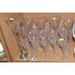 A PART SUITE OF CUT GLASSES, trumpet shaped with double twist stems, of four various sizes (17),