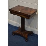 A REGENCY ROSEWOOD CARD TABLE, the fold over top enclosing a green playing surface, on a tapering