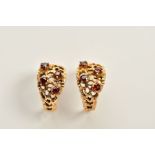 A PAIR OF 9CT GOLD GARNET EARRINGS, each designed as an openwork half hoop, set with four circular