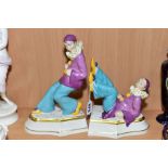 A PAIR OF ROYAL DUX BOOKENDS, stylized as a pair of Pierrot/clowns, dressed in purple jacket and