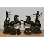 A PAIR OF LATE 19TH CENTURY PATINATED SPELTER FEMALE FIGURES IN HORSE DRAWN CHARIOTS, with rearing