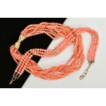 TWO CORAL BEAD NECKLACES, the first with nine strands of round beads in a twisted necklace, each