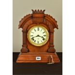 A LATE 19TH CENTURY ANSONIA WALNUT CASED MANTEL CLOCK, the arched case with carved detail, enamel
