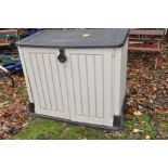 A PLASTIC GARDEN TOOL CUPBOARD with lift up lid and two doors to front, width 127cm x depth 72cm x