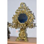 A LATE 19TH CENTURY GILT METAL FRAMED TOILET MIRROR ON STAND, the circular mirror surrounded by an