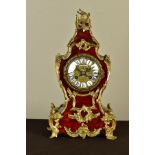A LATE 19TH CENTURY TORTOISESHELL AND GILT METAL ROCOCO STYLE MANTEL CLOCK, the brass dial with