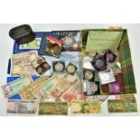 A SMALL BOX OF COINS AND BANKNOTES to include a carded Millennium crown, a 1983 B.U. coin set, early