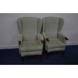 A PAIR OF MODERN HSL LIGHT GREEN UPHOLSTERED WINGBACK ARMCHAIRS, inner width 50cm