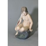 A ROYAL COPENHAGEN FIGURE, 'Girl on a Rock', No 40274 designed by Adda Bonfils, height 14cm