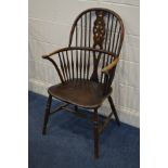 A 20TH CENTURY OAK WHEEL AND SPINDLE HOOP BACK WINDSOR ARMCHAIR, on turned legs united by a H