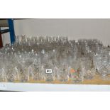 A QUANTITY OF ASSORTED DRINKING GLASSES, mostly cut glass, some Stuart Crystal but majority are
