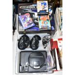 A BOXED SEGA MEGA-DRIVE, with two controllers, Sega PSU, TV adapter and three Sonic games