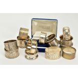 A QUANTITY OF SILVER NAPKIN RINGS, to include thirteen rings of various designs, all with