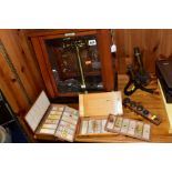 TWO CASES OF MICROSCOPE SLIDES, A HENRY CROUCH BRASS AND BLACK LACQUERED MICROSCOPE, (no case)