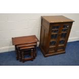 AN OLD CHARM OAK NEST OF THREE TABLES together with an Old Charm oak lead glazed two door hi fi