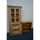 A STANDING PINE CORNER CUPBOARD, double glazed doors enclosing two fixed shelves above panelled