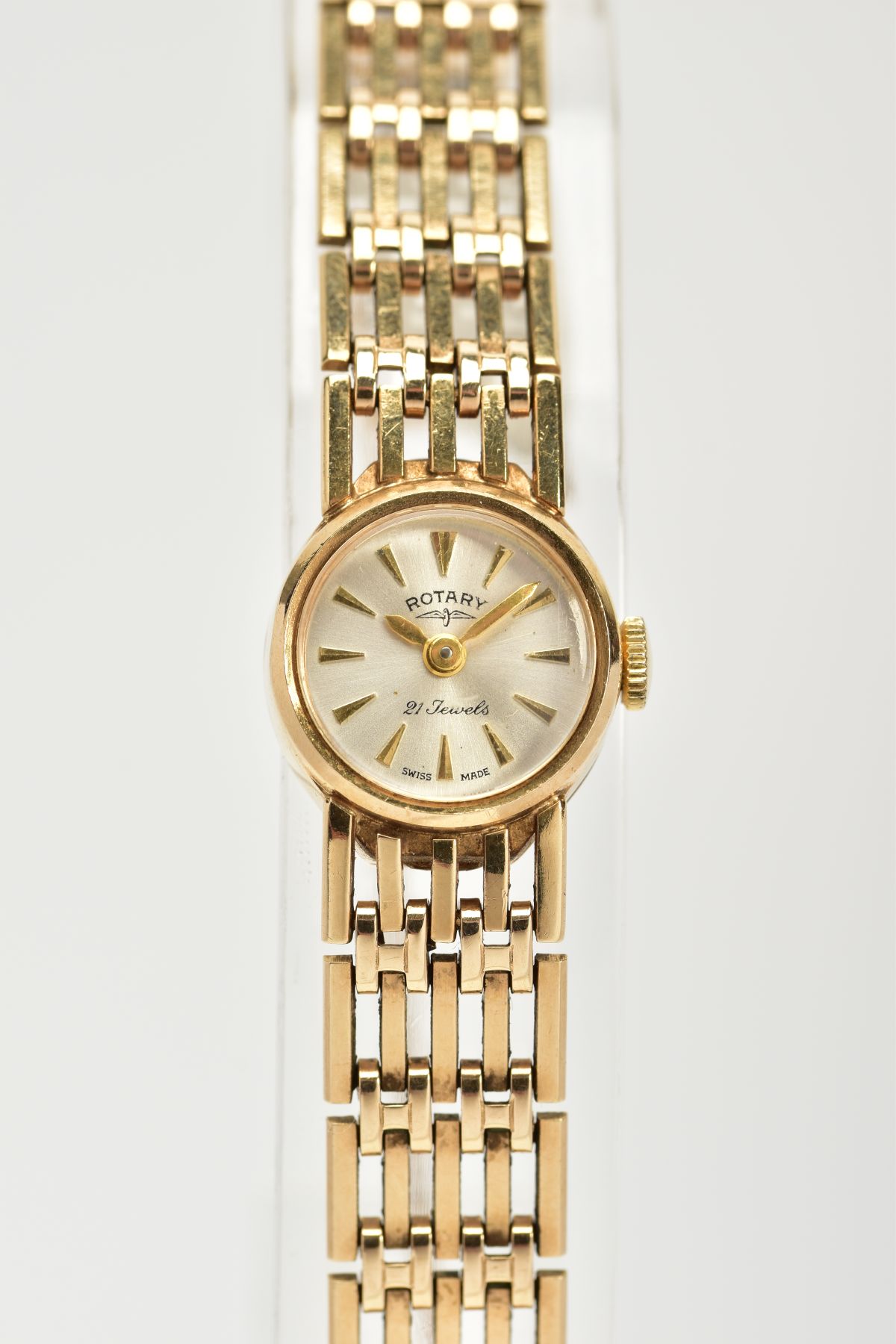 A 9CT GOLD LADY'S HAND WOUND 'ROTARY' WRISTWATCH, silver dial, baton markers, gold coloured hands,