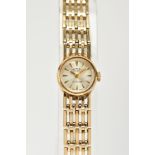 A 9CT GOLD LADY'S HAND WOUND 'ROTARY' WRISTWATCH, silver dial, baton markers, gold coloured hands,